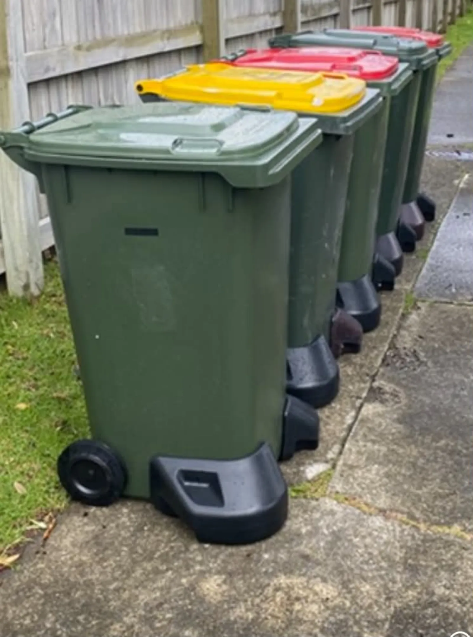 BinUpright stabiliser fitted to a row of kerbside bins